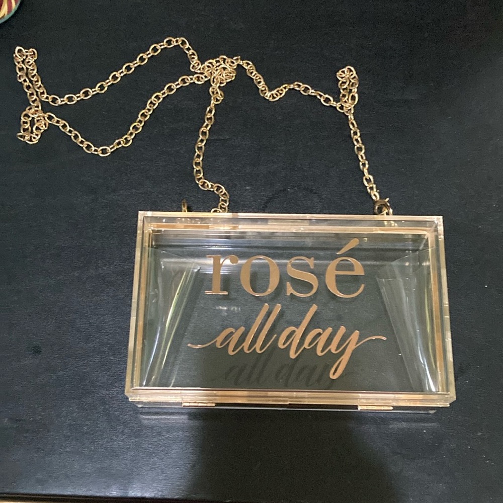 Rose’ All Day see through clutch purse.